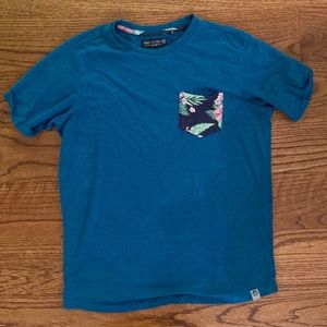Mens blue pocket tee with tropical pattern